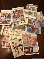 Group of sewing pattern envelopes spread on table