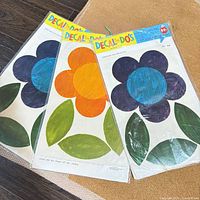 Three sealed Decal-Do's flower decal sheets