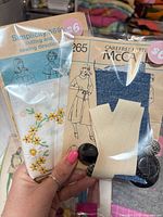 Both ephemera kits side by side in plastic wrap