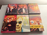 Front covers of all six CSI: Miami DVD season sets