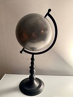 Full view of globe on stand