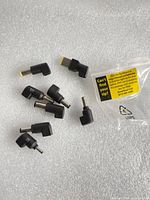 Eight adapter tips on foam surface