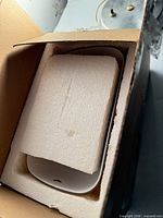 Shade packed in original box with top styrofoam insert visible
