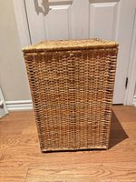 Closed rectangular wicker hamper front view