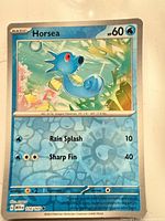 Front of Horsea 116/165 card showing artwork, stats and set number