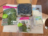 Lot overview showing two moss packs, box of foam blocks, two pebble packs
