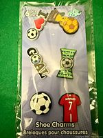 Front view sealed pack showing six charms and graphics