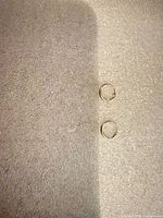Full lot view showing both sterling silver hoop earrings