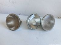 Three PAR38 bulbs front view showing lenses and condition