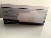 Front of box showing product image and dimensions