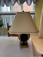 Full view of lamp with shade on table