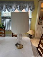 Front view of complete lamp showing crystal body and shade
