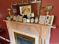 Mantel view with all picture frames