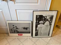 Both posters leaning against door showing full fronts
