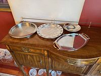 All four trays arranged on sideboard