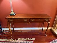 Front view showing full console table, drawers, legs and hardware