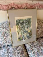 Full view of framed print showing garden scene, mat and gold frame