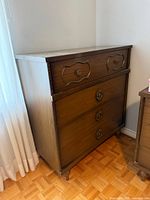 Front and side view of 4-drawer dresser showing hardware and finish