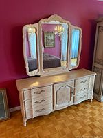 Full view of dresser with mounted tri-fold mirror