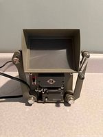 Front view showing screen, controls, reel spindles