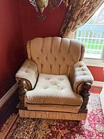 Front view of armchair showing overall design and condition