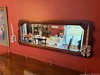 Front view showing entire mirror and both sconces