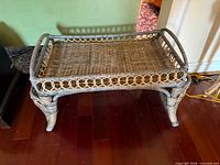 Top view of rectangular wicker breakfast tray showing woven surface and raised gallery
