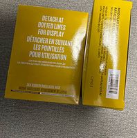 Backs of two yellow Soo'AE Skin Recovery Biocellulose Mask boxes