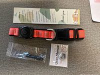 Full set: red collar with tracker, QR tag, ring, screwdriver, manual and thank-you insert