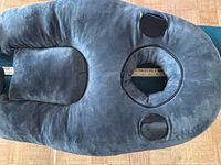 Top view of face-down pillow showing breathing opening, velcro pads, ruler for scale