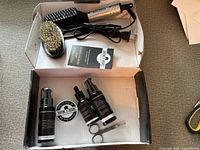 Open box showing entire beard grooming kit contents