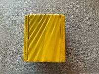 Closed yellow Invicta presentation box