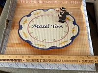 Platter in original box with text Judaica Bride/Groom 13" Platter visible