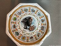 Front of plate showing artwork, symbols and Hebrew text