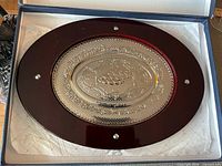Full view of oval silver tray in box
