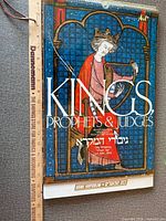 Front cover showing title, illustration of crowned king, spiral binding