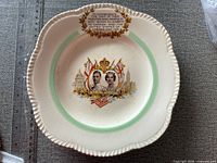 Front of 1939 royal visit ceramic plate showing portraits, flags and inscription