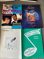 Front covers of four music books
