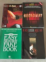 Front covers of four music books
