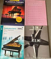 Front covers of the four sheet-music books arranged in grid