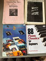 Front covers of all four music books