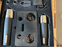 Boxed set showing opener, preserver, base, stoppers, foil cutter, adapter in foam insert