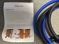 Manual showing introduction text beside blue and black resistance tubing