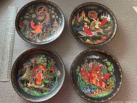 Front view of four decorative plates