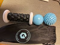 Roller, two balls, and bag laid out