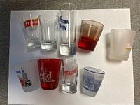 Group of nine assorted shot glasses