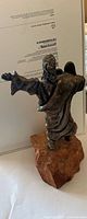 Rear view of sterling silver Moses figurine on stone base