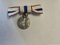 Front view showing reverse design and full ribbon