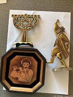 Front view of menorah, enamel plaque and dancer figurine