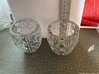 two cut crystal glasses side by side with ruler for scale